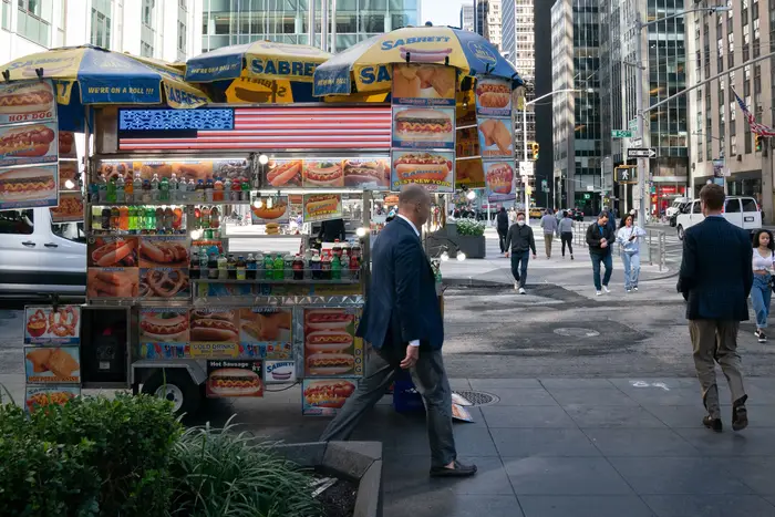 a food cart on a New York City sidewalk